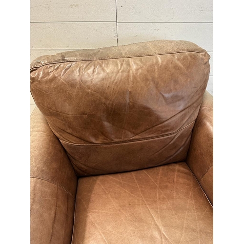 1 - A pair of brown leather club arm chairs