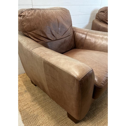 1 - A pair of brown leather club arm chairs