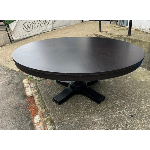 102 - A contemporary black circular dining table on turned centre base (H75cm Dia189cm)