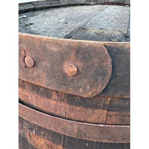 119 - Two reclaimed timber metal banded whisky barrels (H127cm Dia67cm) ( H110cm Dia 75cm)