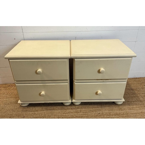 126 - A pair of white painted two drawer bedside tables on bun feet (H53cm W51cm D43cm)