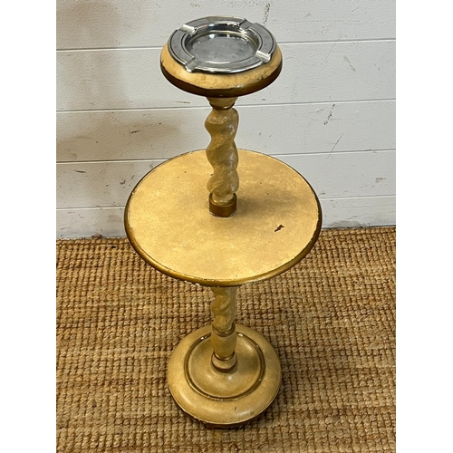 128 - A turned wood ashtray and side table stand H 70 cm