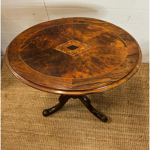 13 - A side table with figured oval top and turned legs (H68cm W65cm D46cm)