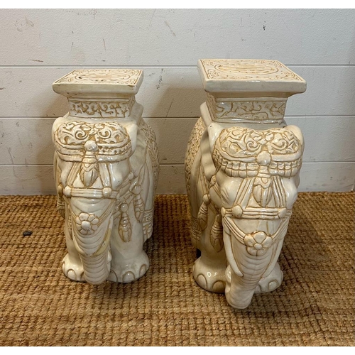 130 - Two white ceramic elephant themed plant stands (H37cm and H39cm)