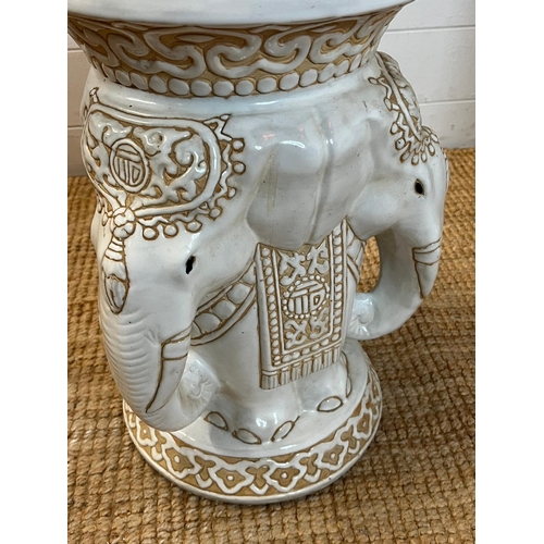 131 - A white ceramic pierced elephant themed plant stand H44cm