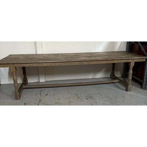 141 - A large farm house refectory table on turned legs with cross stretchers (H80cm W309cm D100cm)