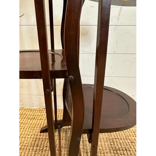 144 - A mahogany folding four tier cake stand