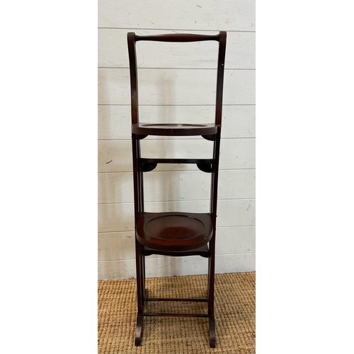 144 - A mahogany folding four tier cake stand