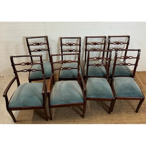 149 - Eight mahogany Regency style dining chairs with carved backs and brass string inlay to include two c... 