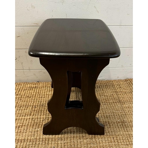 162 - A nest of two stained oak Mid Century side tables (H39cm W45cm D30cm)