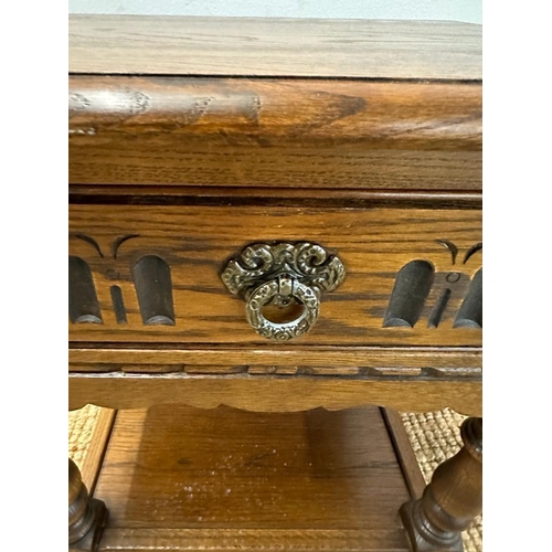 167 - A vintage oak single drawer side table with shelf under (H53cm W96cm D38cm)