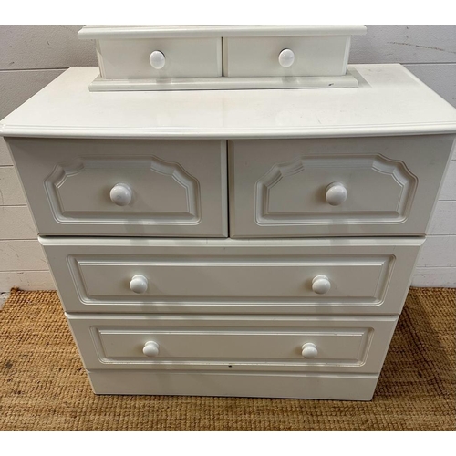 177 - A white two over two chest of drawers and a two drawer bathroom mirror (H74cm W83cm D46cm)