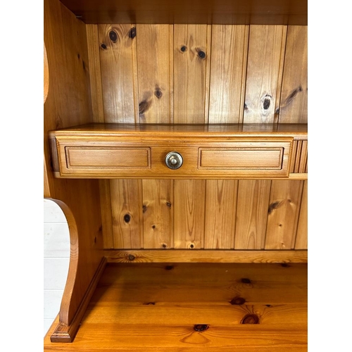 184 - A pine two drawer two cupboard dresser with a two drawer plate rack over (H185cm W97cm D44cm)