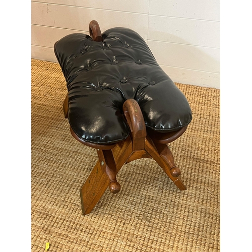 194 - A camel saddle stool (H40cm W62cm D39cm)