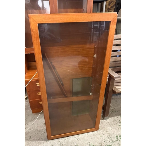 199 - A G plan display unit. Three drawers and glazed cupboard over with two glazed wall hanging cupboards... 