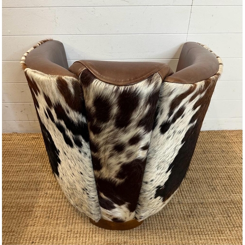 2 - Two cow hide backed brown tub chairs