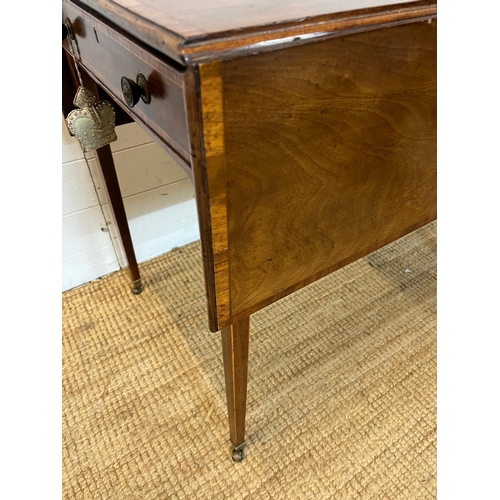 20 - A drop sided Pembroke table on tapering legs and drawers (H72cm W106cm D81cm