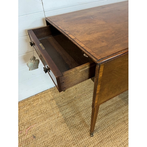 20 - A drop sided Pembroke table on tapering legs and drawers (H72cm W106cm D81cm