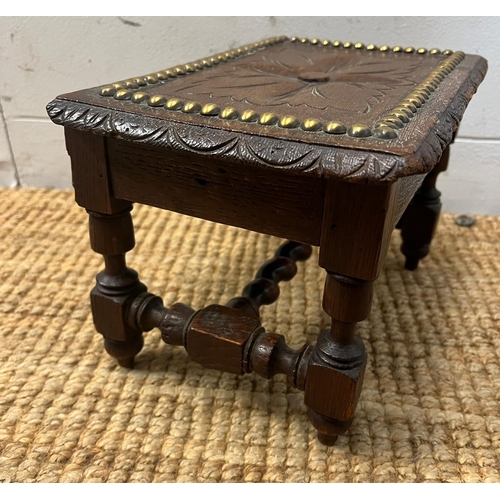 207 - A low carved stool with stud work to top, possibility on an apprentice piece (H20cm W30cm D19cm)