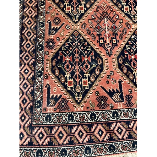 214 - A Persian style rug with geometric pattern 170cm x 142cm