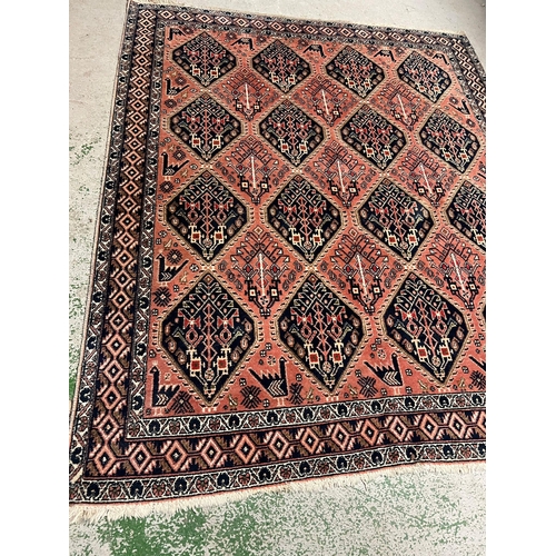 214 - A Persian style rug with geometric pattern 170cm x 142cm