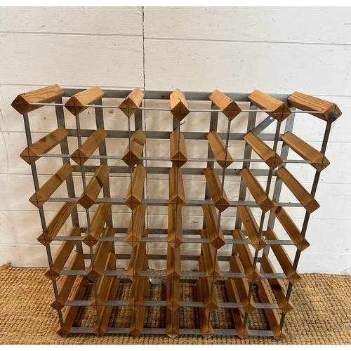 22 - A wooden thirty six bottle wine rack