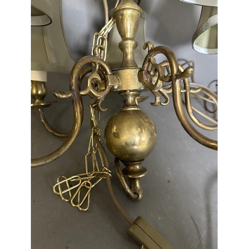 223 - A brass five arm ceiling light with green satin shade