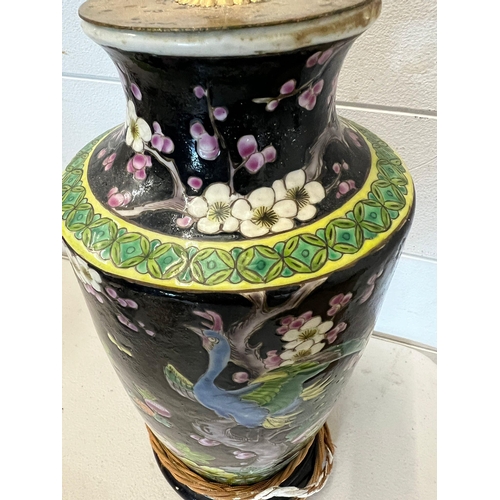 232 - A porcelain table lamp decorated with birds of paradise and lotus flowers (H46cm)