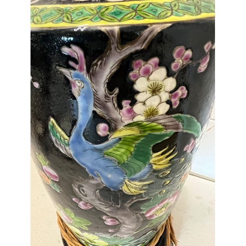 232 - A porcelain table lamp decorated with birds of paradise and lotus flowers (H46cm)