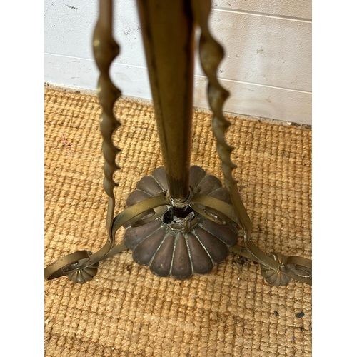 241 - A brass floor standing lamp on scrolling feet (H180cm)