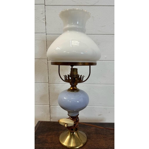 247 - Two Victorian style table lamps on brass bases, one with cranberry glass shade and the other a white... 