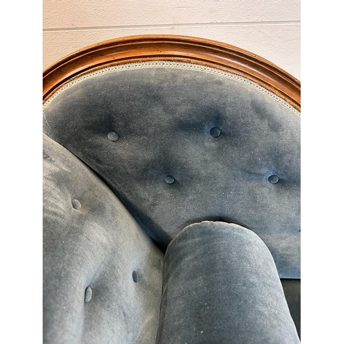 25 - A Victorian blue upholstered chaise longue with button back on a carved mahogany frame (H85cm W190cm... 