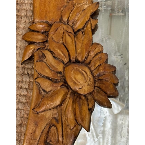 263 - A pine bathroom mirror with a floral carved frame and shelf under 80cm x 48cm AF