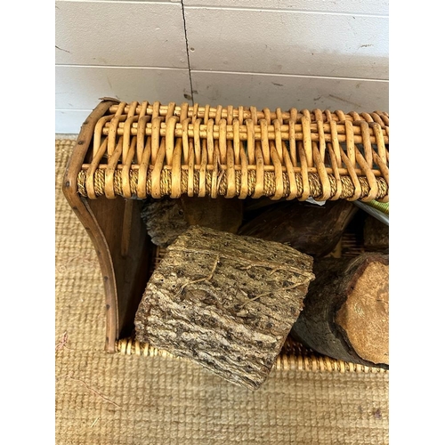 27 - A wicker three quarto barrel shaped log basket (W64cm)