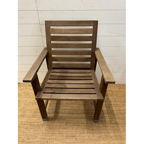 281 - A pair of slatted wooden garden chairs