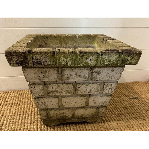 288 - A square concrete garden planter with a brickwork design (H31cm W38cm D38cm)