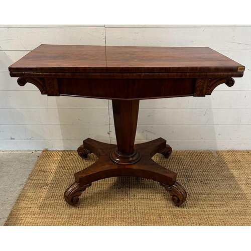 29 - A Regency style mahogany fold over tea table with hexagonal central support terminating on four scro... 