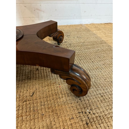 29 - A Regency style mahogany fold over tea table with hexagonal central support terminating on four scro... 