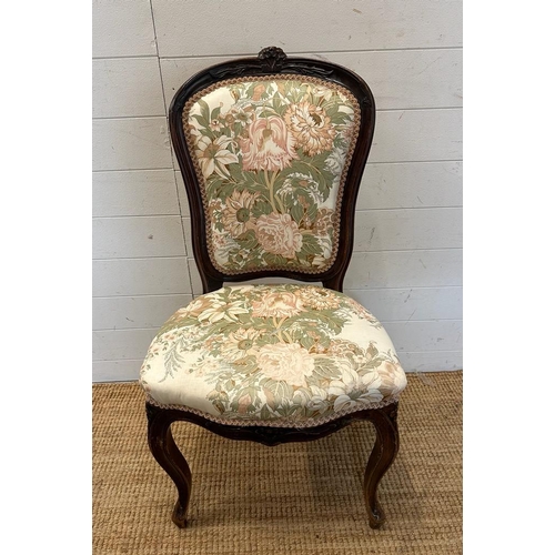 30 - A mahogany framed Empire style chair with floral upholstery