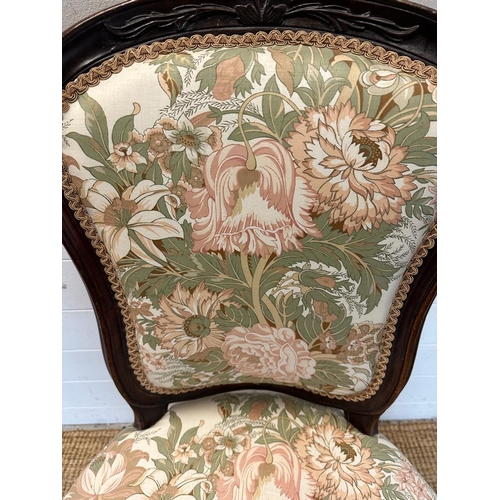 30 - A mahogany framed Empire style chair with floral upholstery