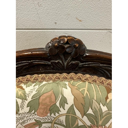 30 - A mahogany framed Empire style chair with floral upholstery