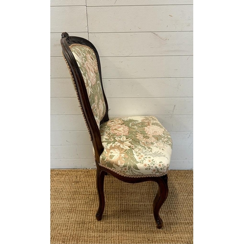 30 - A mahogany framed Empire style chair with floral upholstery