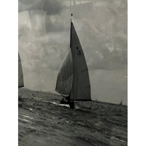 302 - A black and white print of racing yachts 75cm x 64cm