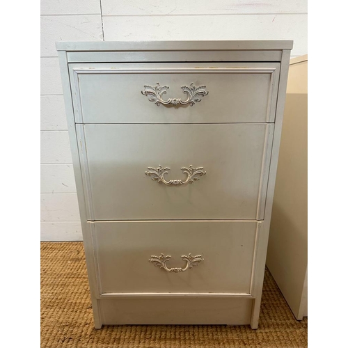 31 - A pair of white bedside tables with Louis style handles (H69cm W44cm D42cm)