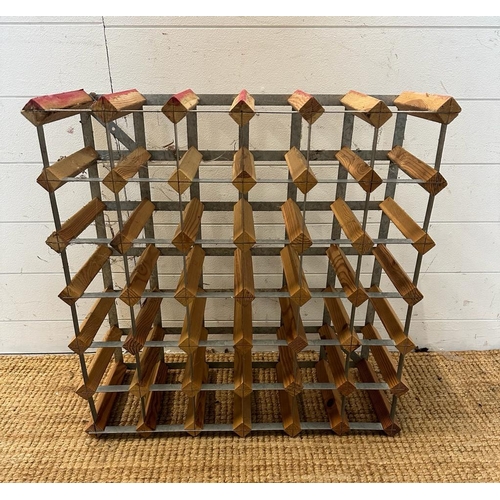 33 - A wooden thirty six bottle wine rack