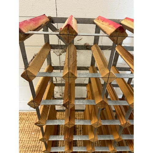 33 - A wooden thirty six bottle wine rack