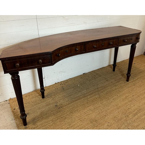 34 - A mahogany carved console table with four drawers on fluted legs (H80cm W176cm D38cm)