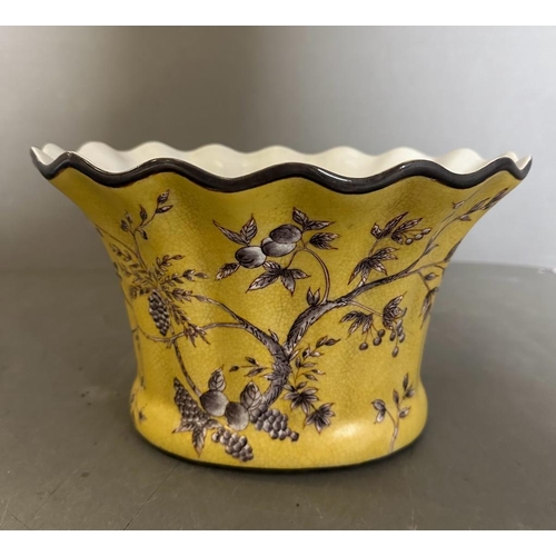 360 - A yellow ground planter with a vine and olive pattern