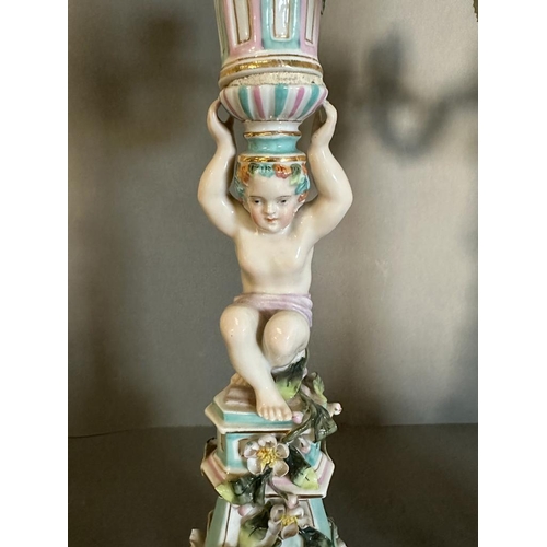 374 - A pair of figural four arm Dresden ceramic candle stick