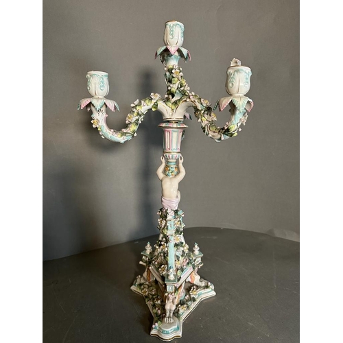 374 - A pair of figural four arm Dresden ceramic candle stick